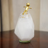 Faceted Glass Décor Piece with Golden Figure